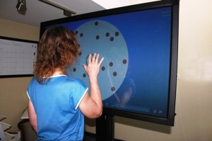 Woman undergoing computerized vision training program